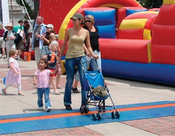 Cable protectors installed across parade walkways to improve safety